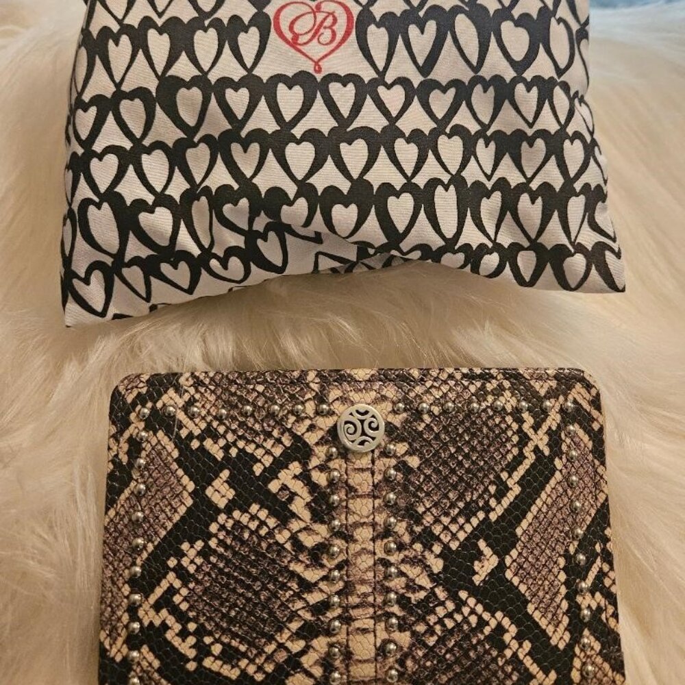 Brighton medium size leather wallet in snake skin print with silver studs.